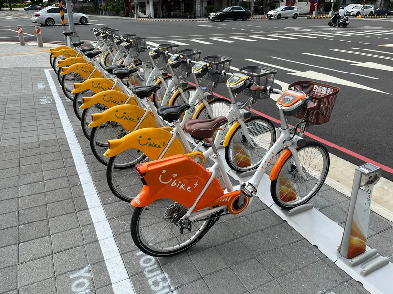 The orange bike in front is the pedal-assist 2.0E; the yellow ones behind are 2.0s, sharing the same posts